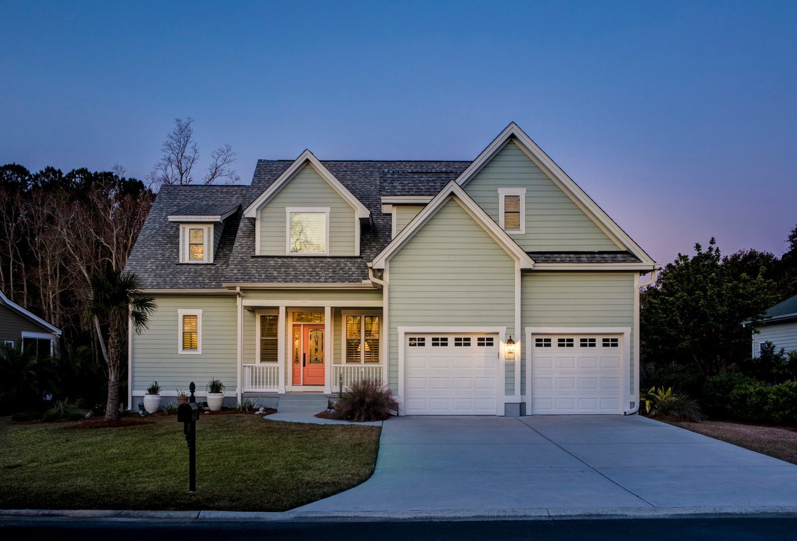 front-elevation-of-beautiful-home-lit-up-at-twilig-2024-12-06-03-48-31-utc-scaled.jpg